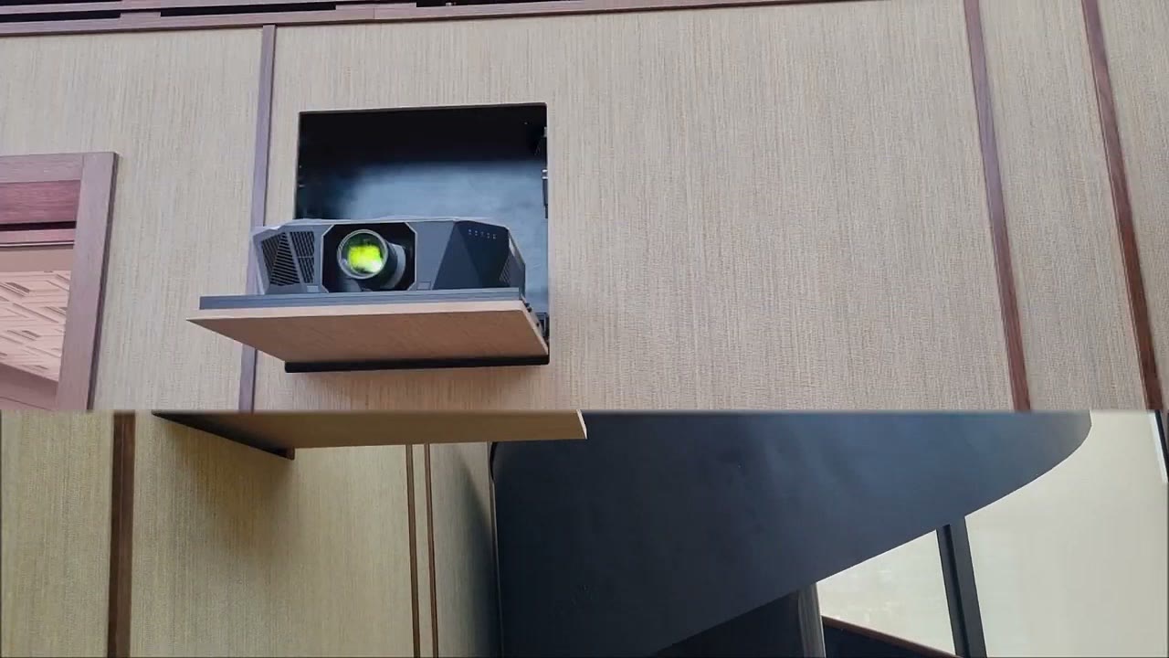 Durumetal hidden projector lift fully deployed from a concealed wood-panelled wall