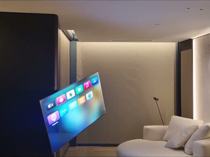 Durumetal rotating TV mechanism swivelling out from the wall in a warm luxury lounge